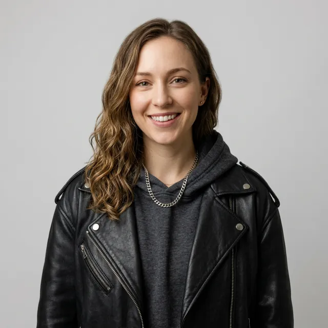 The woman in a black leather jacket in a photo studio